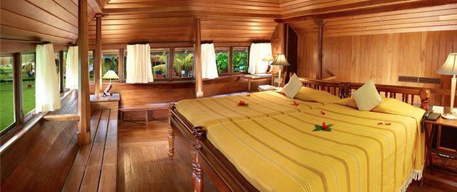 My room at Cococnut Lagoon - the hotel and villas are designed like a traditional Keralan Village