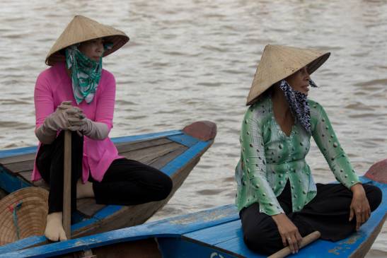 women on a boat in the mekong delta vietnam