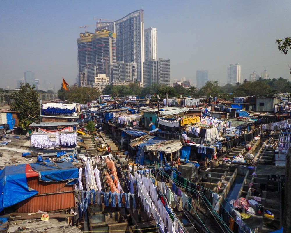 Contrasts of Mumbai - laundry at Dhobi Ghat against a backdrop of a modern highrise