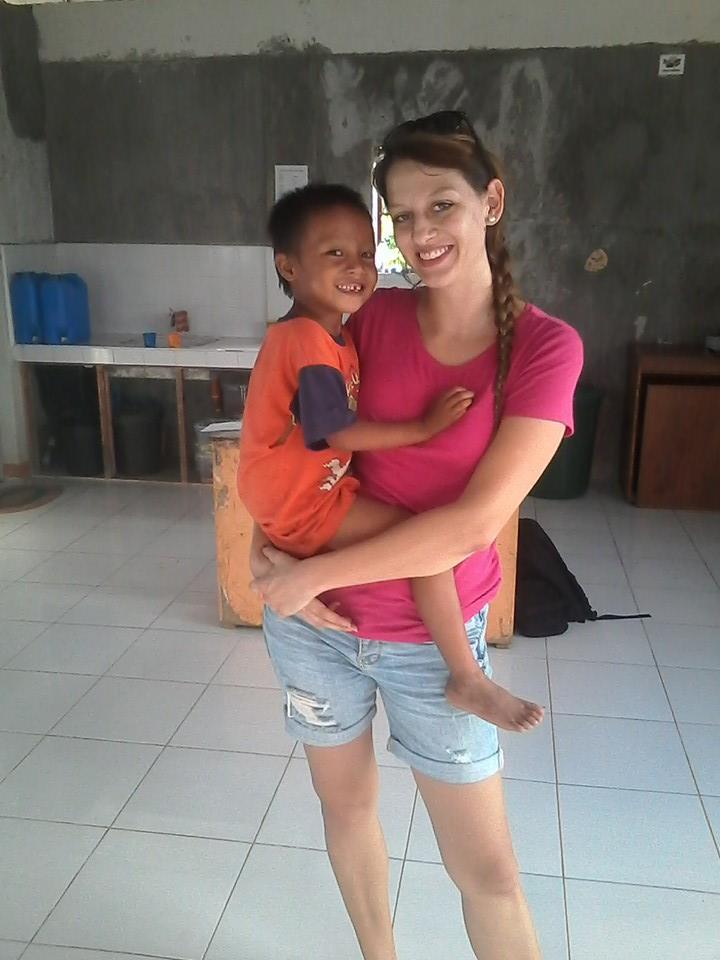 Elsa with one of the kids at her community center in a rural village volunteering in the philippines