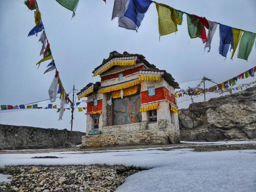 snow and frozen prayer flags on sela pass Arunachal Pradesh