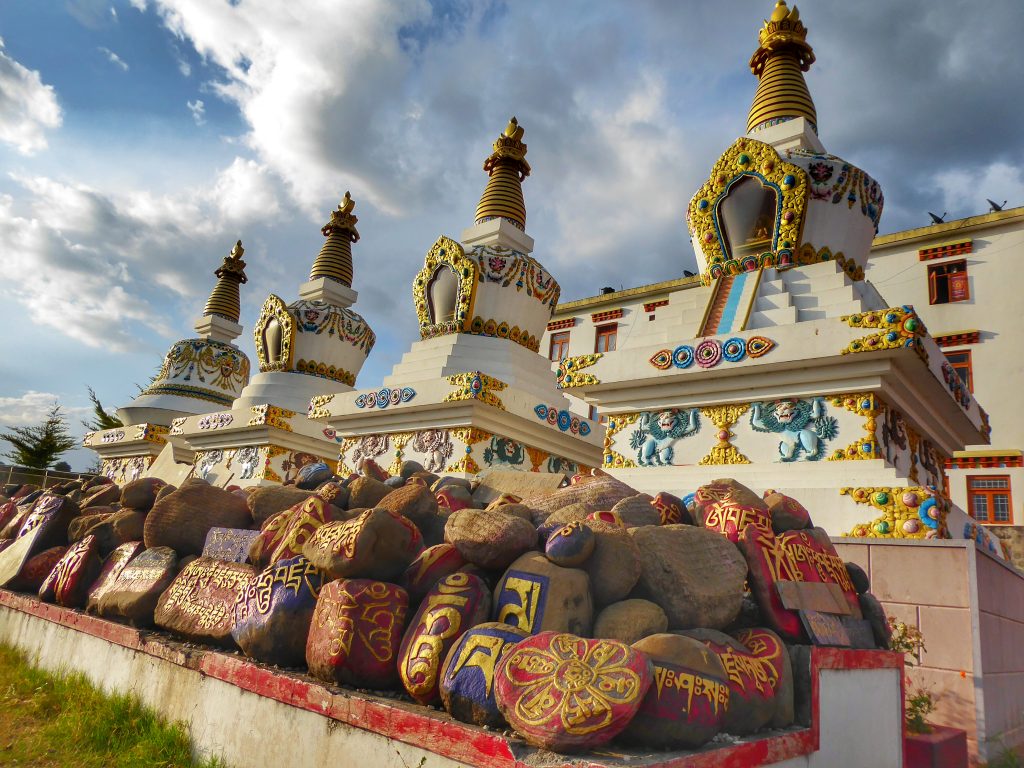 I love how these stones are painted and the Tibetan writing coloured in gold underneath these imposing stupas at Chouckling Monastery