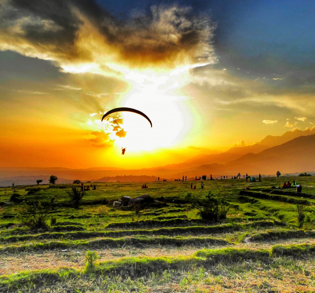 The paragliding landing spot in Bir Billing is also a great place to join the monks and local families who picnic here while the last of the days paragliders drift back down to earth