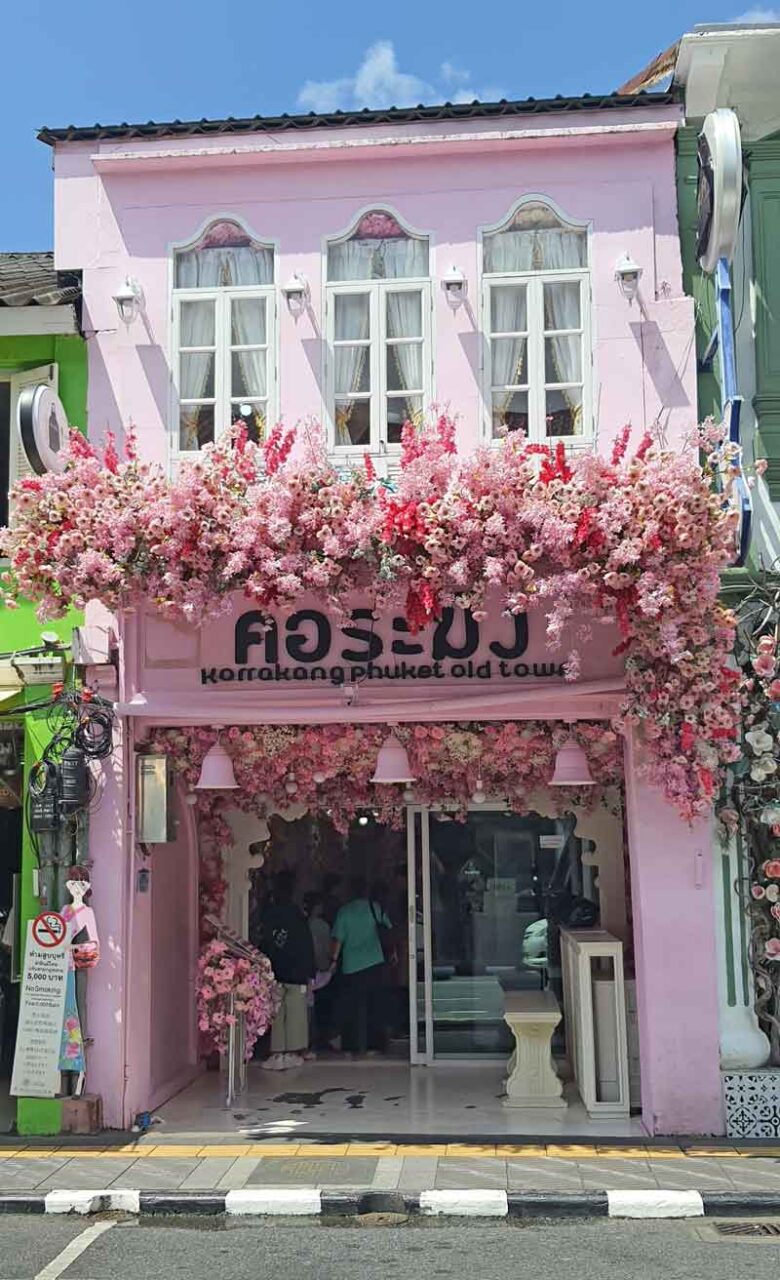pink flower building in phuket old town