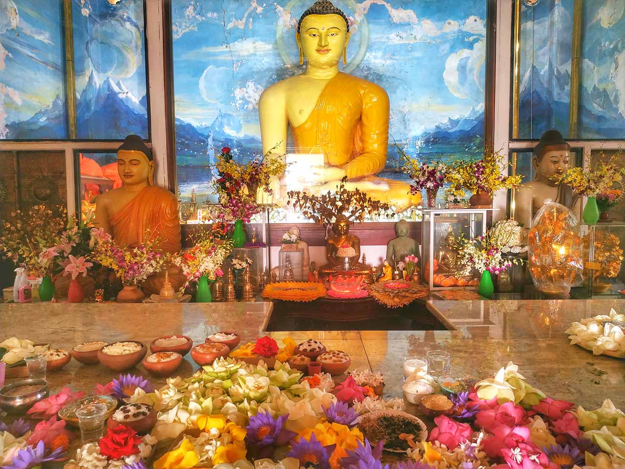 buddha and flowers at anuradhapura